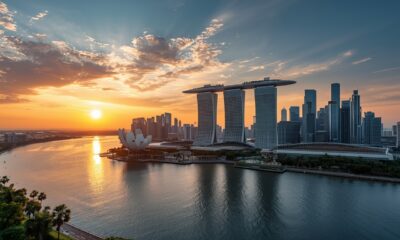 Ultra-luxury Singapore skyline at sunset, Marina Bay waterfront, futuristic high-rise condominiums with sky gardens and infinity pools, warm golden hour lighting, smart glass towers, lush greenery integrated into architecture, reflections on calm water, cinematic wide-angle view, hyper-realistic, 8K resolution, ultra-detailed, professional architectural photography, vibrant yet natural colors, sharp focus, no people, high dynamic range, magazine cover quality